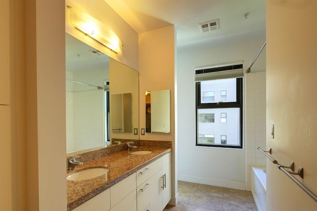 bathroom featuring tile patterned flooring, vanity, and shower / bathing tub combination