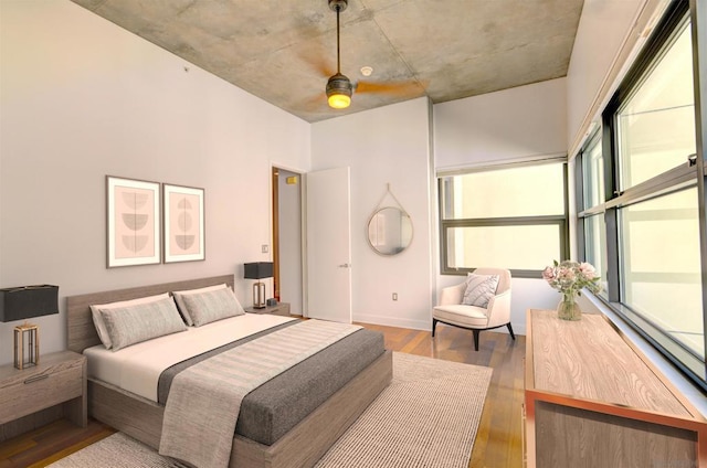 bedroom featuring ceiling fan and light hardwood / wood-style floors