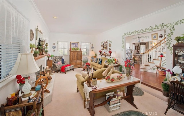 living room with ornamental molding and light carpet