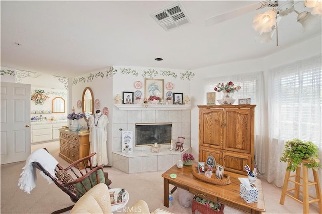 carpeted living room featuring a fireplace