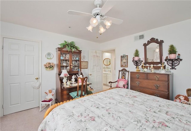 carpeted bedroom with ceiling fan and connected bathroom