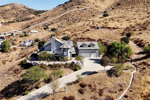 birds eye view of property featuring a mountain view