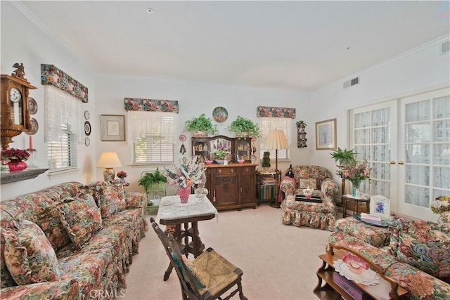 living room with ornamental molding and light carpet