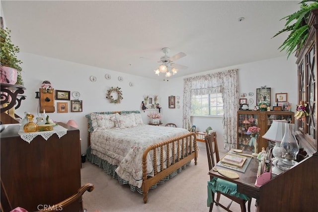 bedroom featuring ceiling fan and light colored carpet