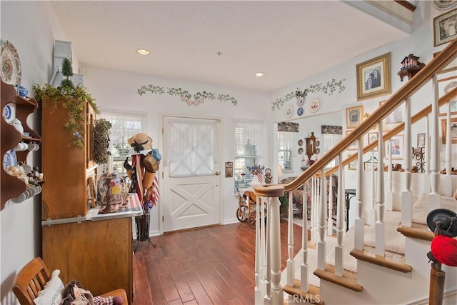 entryway with dark hardwood / wood-style floors