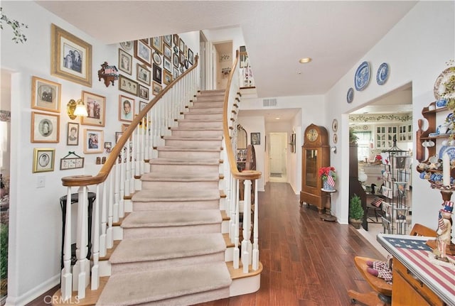 stairway with hardwood / wood-style flooring