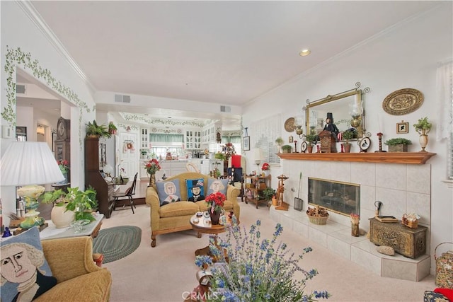 carpeted living room with crown molding and a tiled fireplace