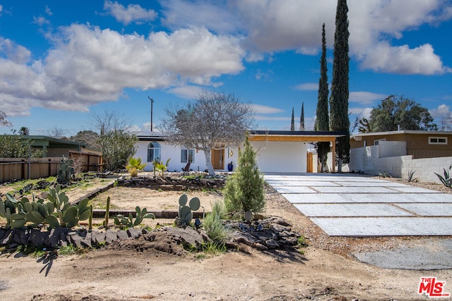 ranch-style home with a carport