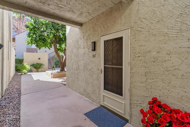 property entrance with a patio