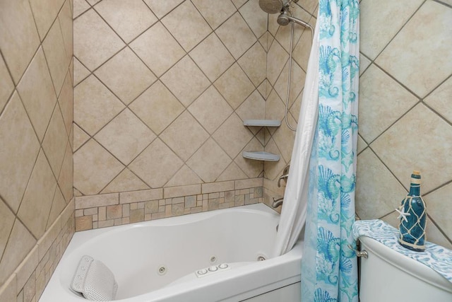 bathroom with shower / bath combo with shower curtain and toilet