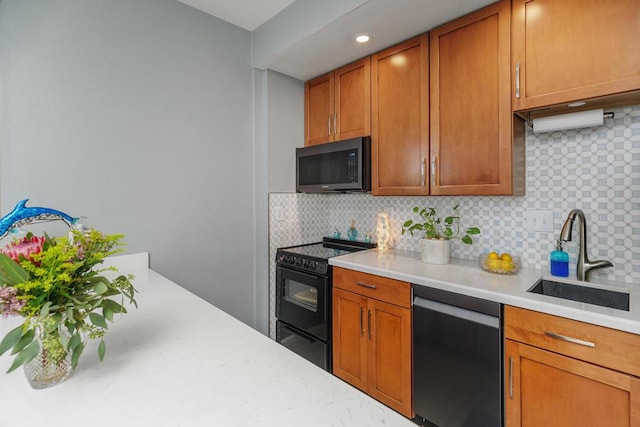 kitchen with sink, backsplash, and black appliances