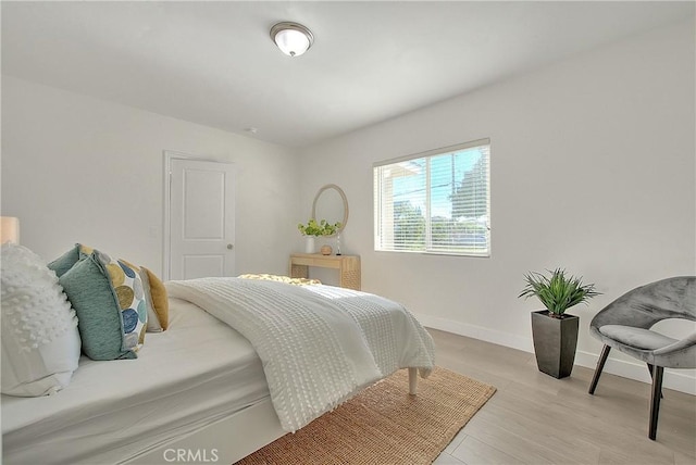 bedroom with light hardwood / wood-style floors