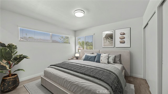 bedroom featuring a closet and light hardwood / wood-style flooring