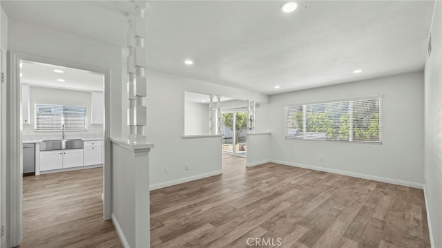 spare room featuring light hardwood / wood-style floors and sink