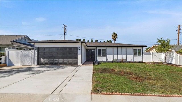 ranch-style house with a garage and a front lawn