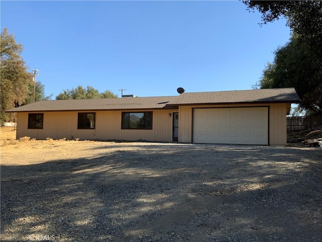 ranch-style house featuring a garage