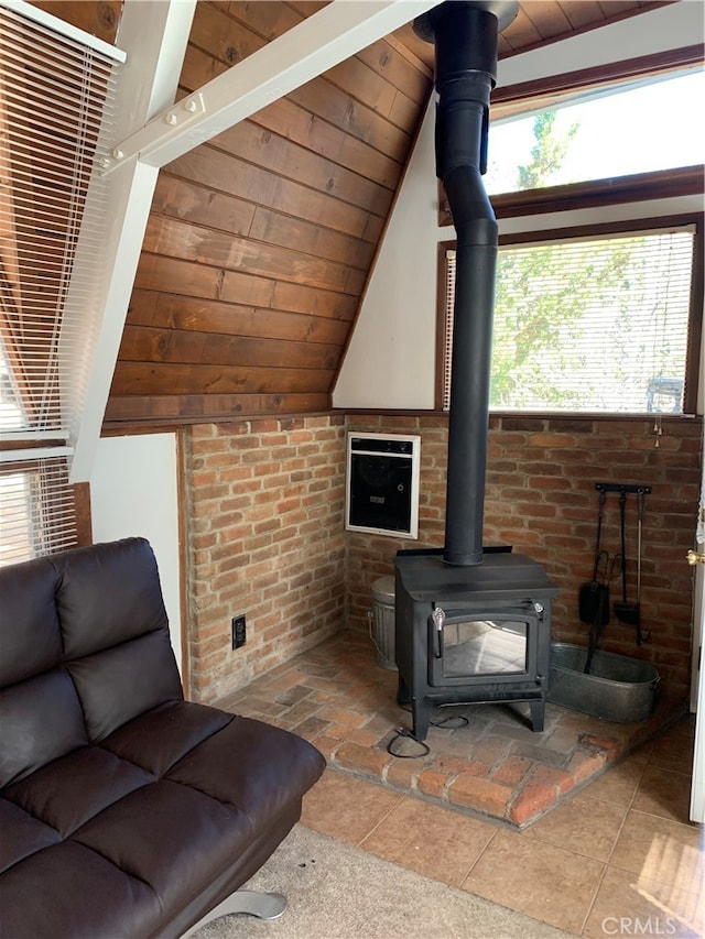 unfurnished living room with wood ceiling, vaulted ceiling with beams, and brick wall