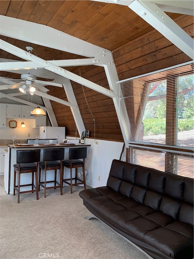 living room featuring ceiling fan, wood ceiling, vaulted ceiling with beams, and light carpet