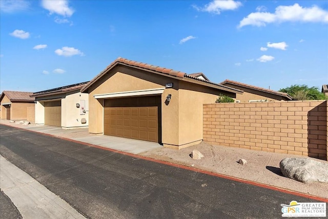 ranch-style house featuring a garage