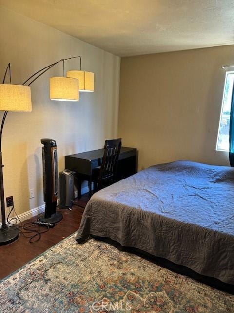 bedroom featuring dark hardwood / wood-style floors and pool table