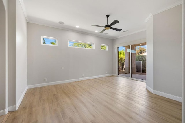 spare room featuring ceiling fan, ornamental molding, and light hardwood / wood-style floors