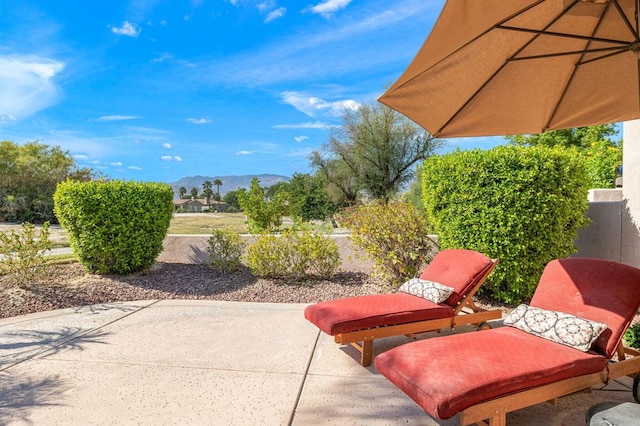 view of patio / terrace featuring a mountain view