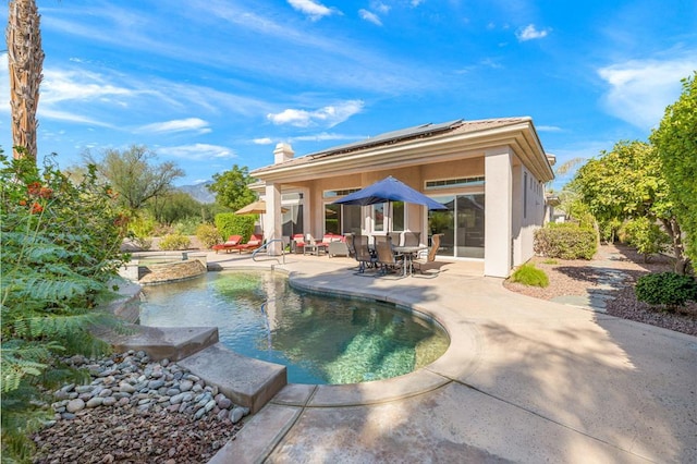 view of pool featuring a patio