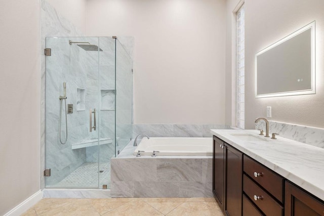 bathroom with tile patterned flooring, vanity, and plus walk in shower