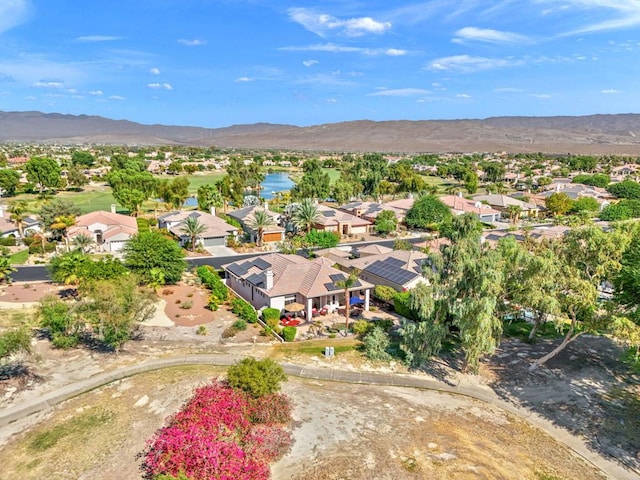 birds eye view of property with a mountain view