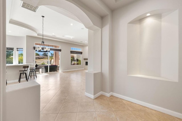 hall with light tile patterned floors