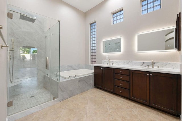 bathroom featuring vanity, tile patterned floors, and shower with separate bathtub