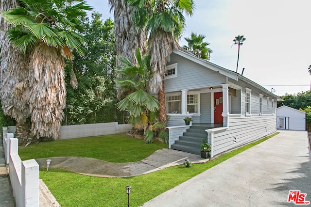 bungalow-style house with a porch and a front yard