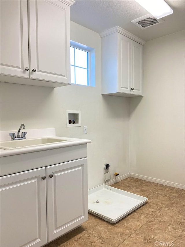 laundry area with washer hookup, cabinets, and sink