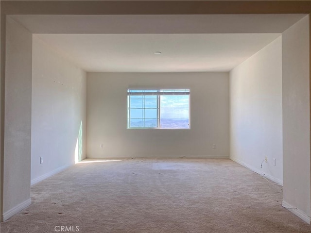 empty room with light colored carpet