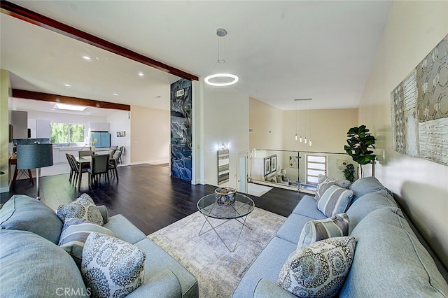 living room featuring beam ceiling and hardwood / wood-style flooring