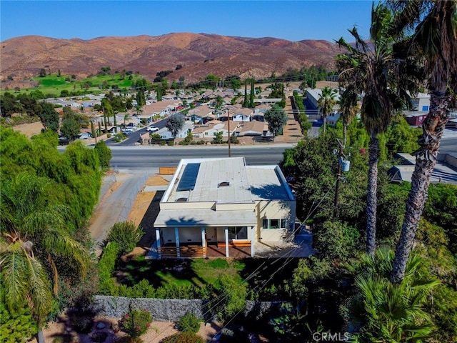 birds eye view of property featuring a mountain view