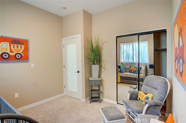 sitting room with light colored carpet