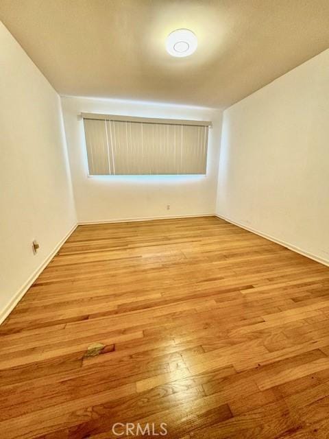 unfurnished room featuring light hardwood / wood-style floors