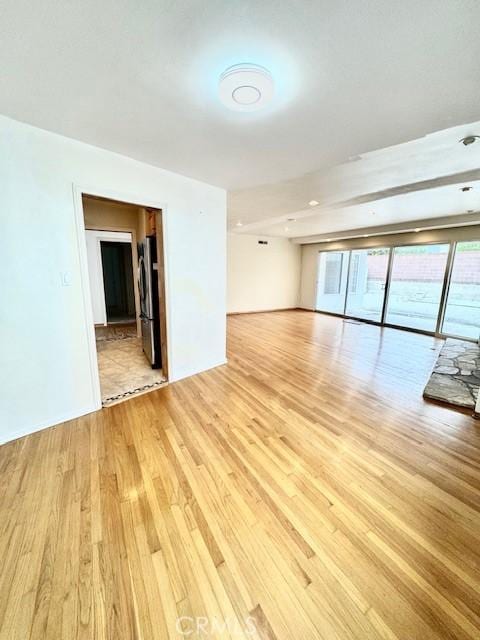 empty room with light hardwood / wood-style floors