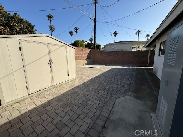 view of patio / terrace featuring a shed