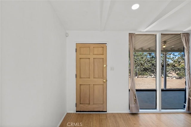 doorway with wood-type flooring