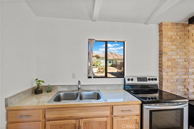 kitchen featuring sink, stainless steel range with electric cooktop, light brown cabinets, and beamed ceiling