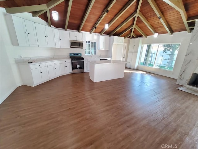 kitchen featuring appliances with stainless steel finishes, dark hardwood / wood-style flooring, a kitchen island, pendant lighting, and white cabinets