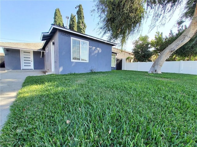 view of home's exterior featuring a lawn