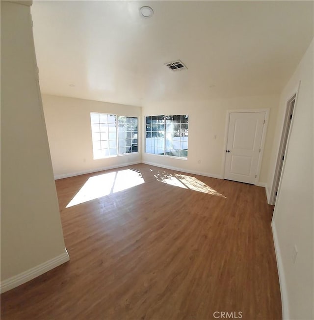 spare room with hardwood / wood-style flooring