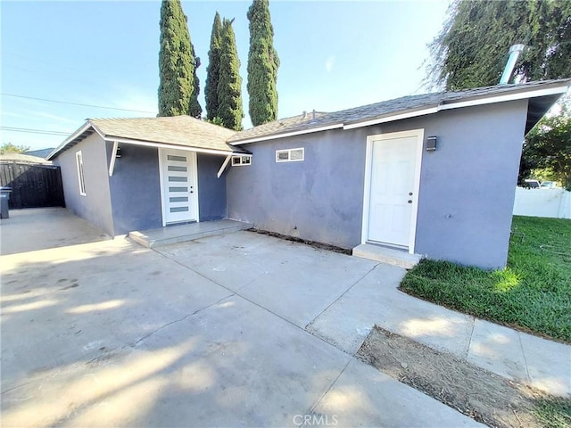 rear view of house with a patio