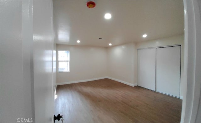 empty room with wood-type flooring