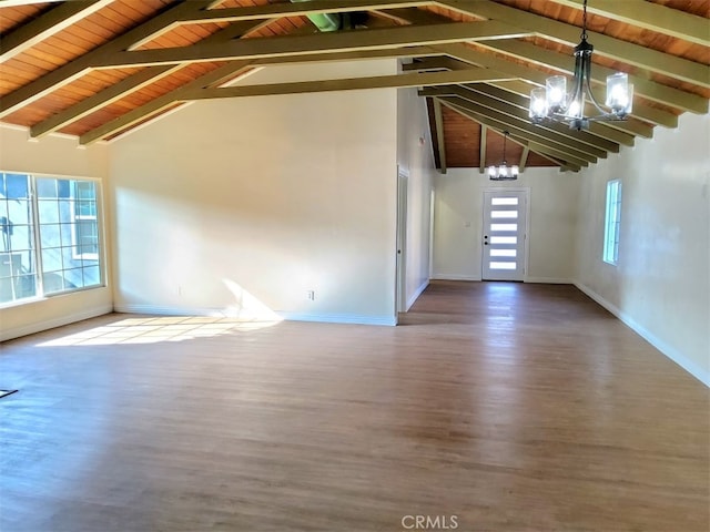 interior space with high vaulted ceiling, beamed ceiling, hardwood / wood-style floors, and a notable chandelier