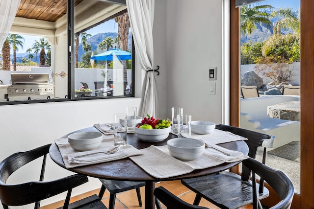 dining space with wood ceiling