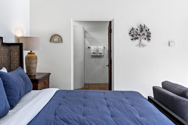 bedroom featuring light tile patterned floors